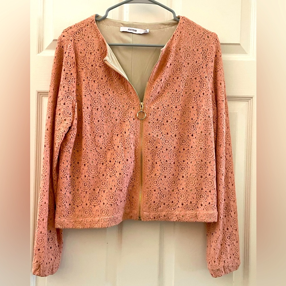 Small, lined accent jacket.